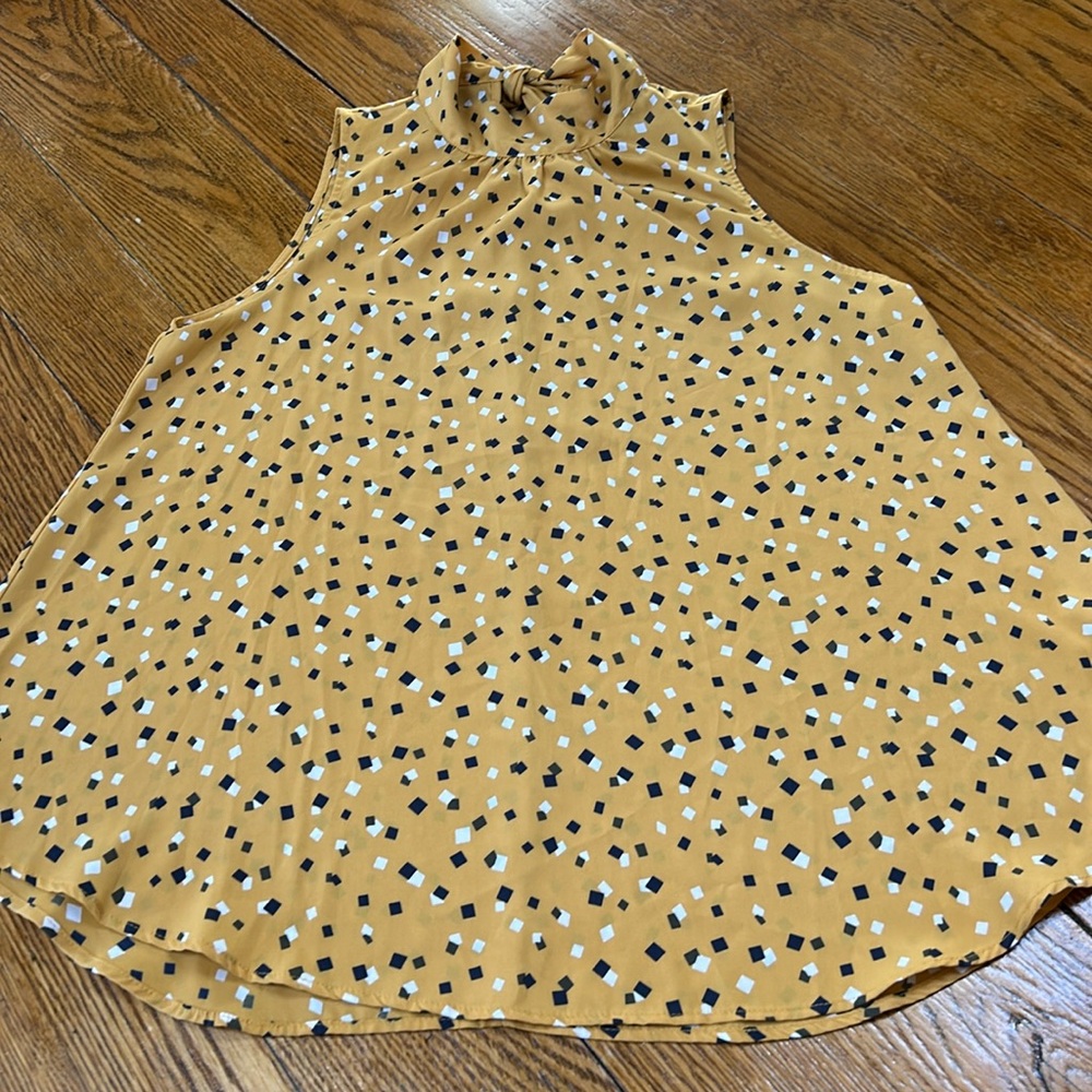 Andree mustard color sleeveless blouse. Bow in back. Size Large. High neck.